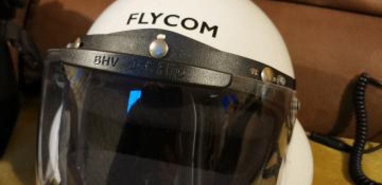 Pair of Flycom helmets size medium with Pod Gear bag.